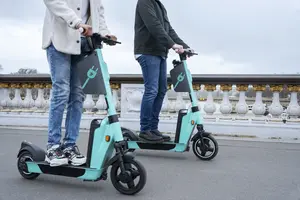 adults learning use electric scooter scaled